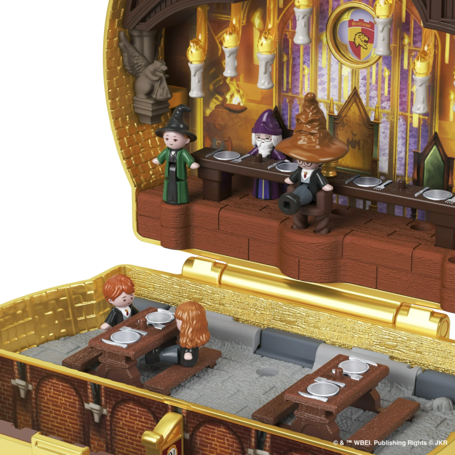 inside of the polly potter harry potter collectors set showing the sorting hat and great hall