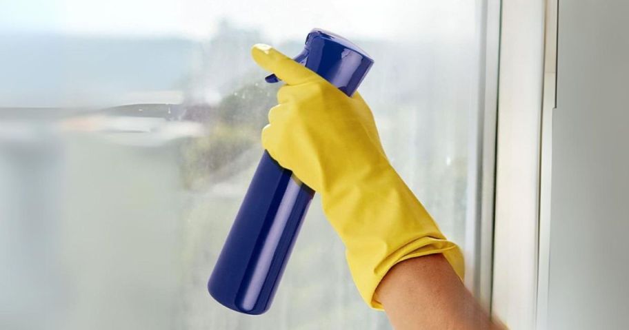 Hula Home Continuous Spray Bottle being used to spray window