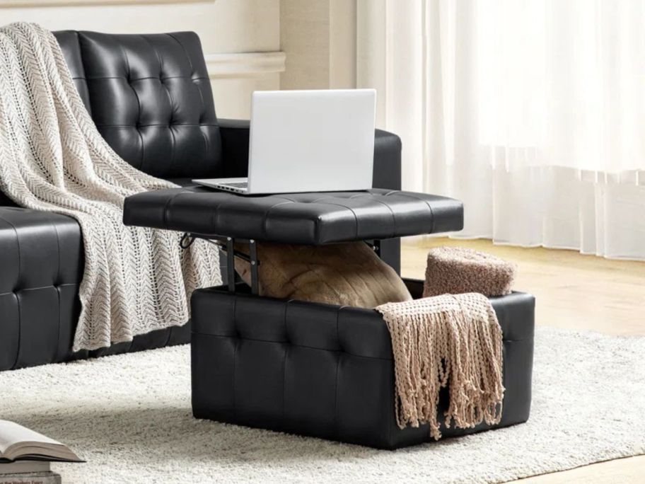 a square leather storage ottoman on a rug in a living room