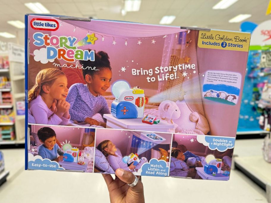 back of little tikes story dream machine box being held by hand in store