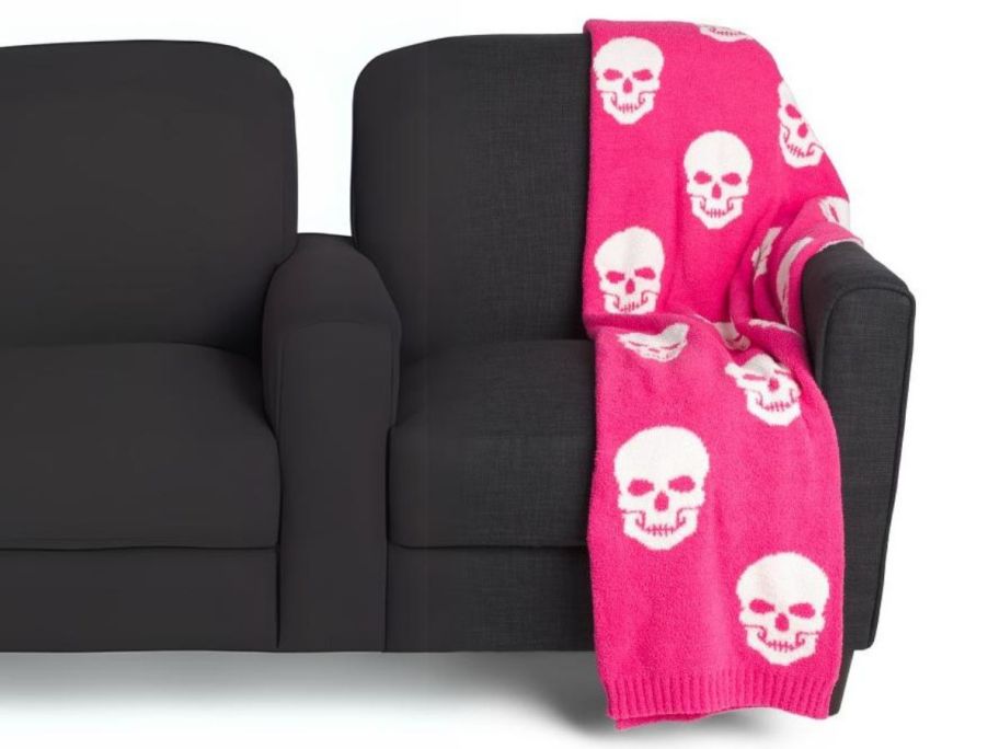 Magaschoni 50 x 70 Feather Knit Skulls Throw on couch