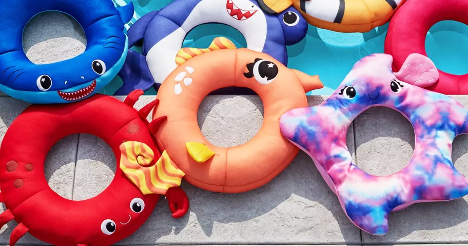 animal pool floats on side of pool