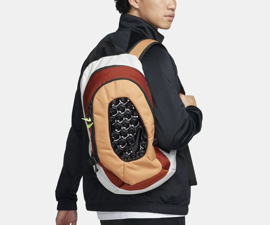 a teen with a nike air backpack