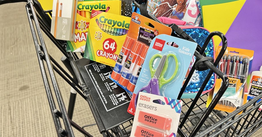 various school supplies in black shopping cart