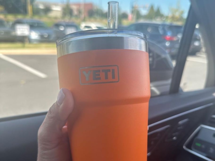 Orange yeti in persons hand