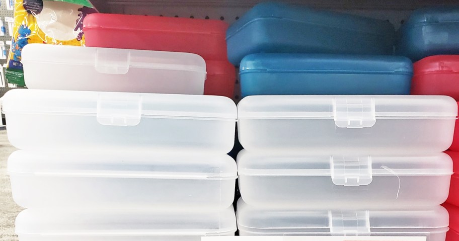 stack of plastic pencil boxes on store shelf