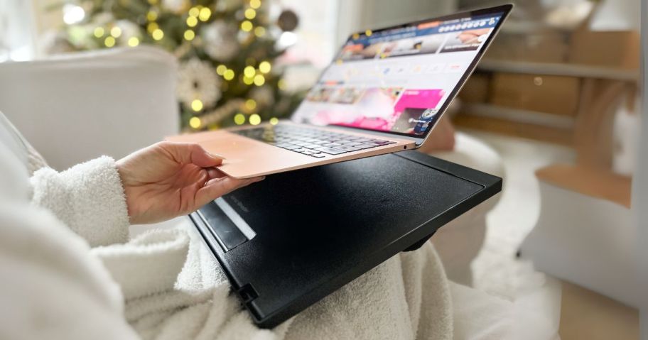 hand holding laptop above Portable Lap Desk