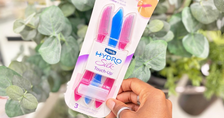 hand holding a set of Schick Hydro Silk Dermaplaning Razors