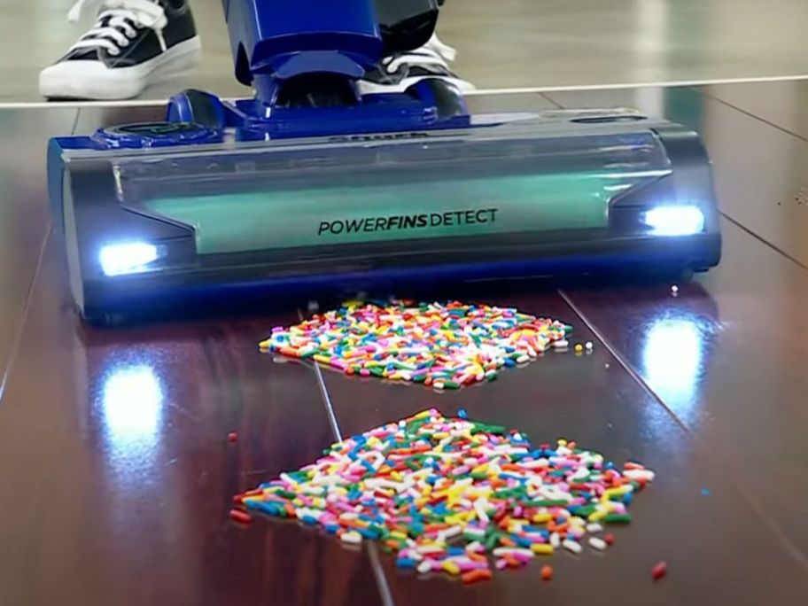 A Shark Detect Vacuum cleaning up sprinkles