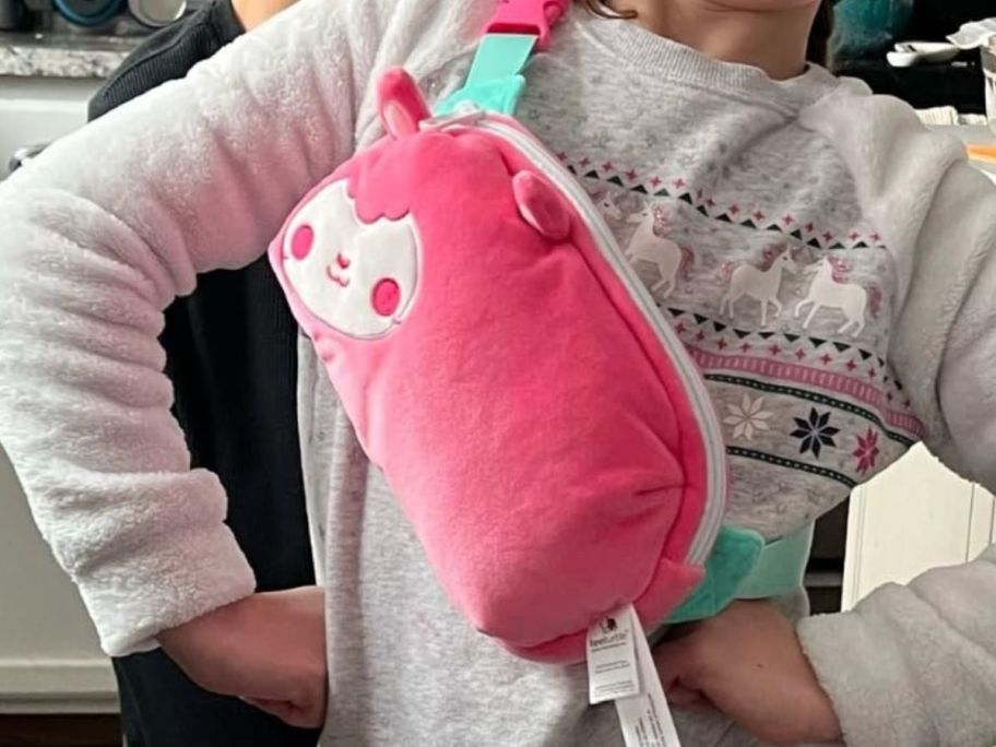 girl wearing TeeTurtle Plushiverse Sheep Plushie Fanny Pack as a crossbody