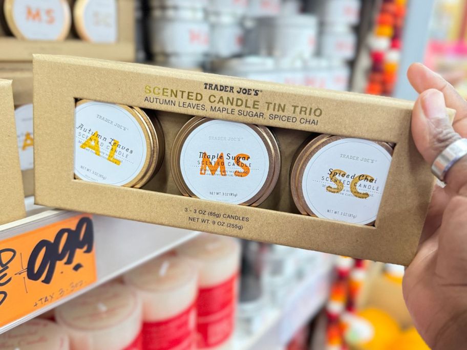 Trader Joe's Scented Candle Tin Trio in box in hand in store