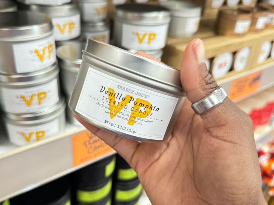 Trader Joe's Vanilla Pumpkin Scented Candle in hand in store