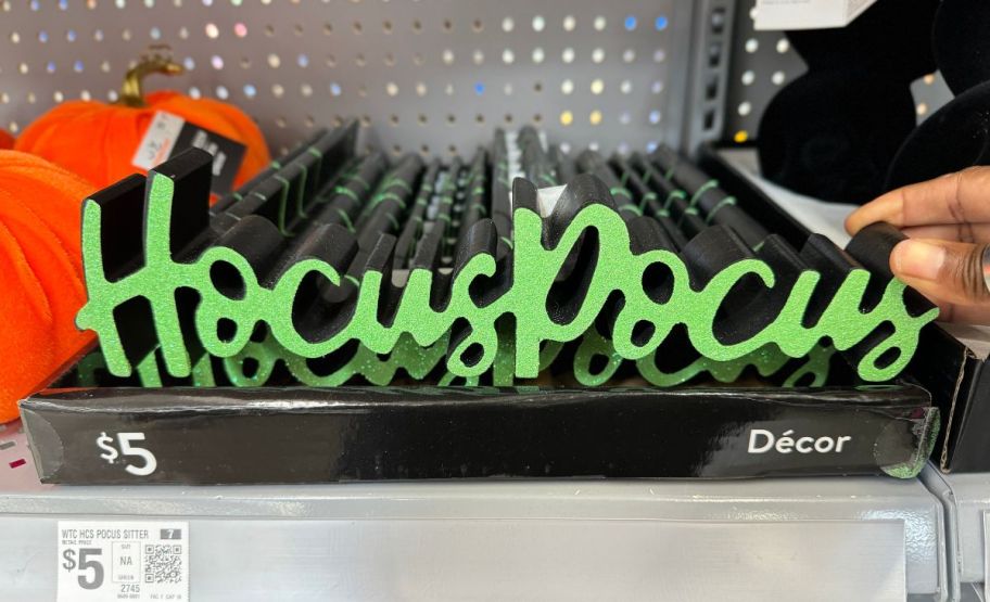 hocus pocus cut out hanging signs on a store shelf