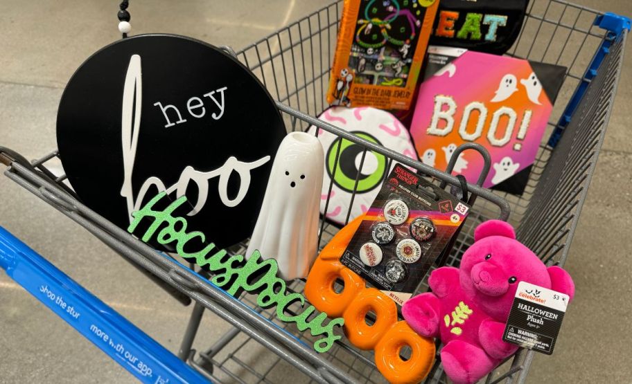 a walmart cart filled with dollar spot halloween finds