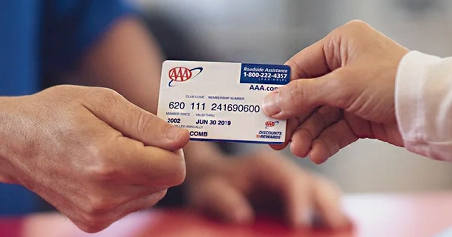 hands holding aaa membership card