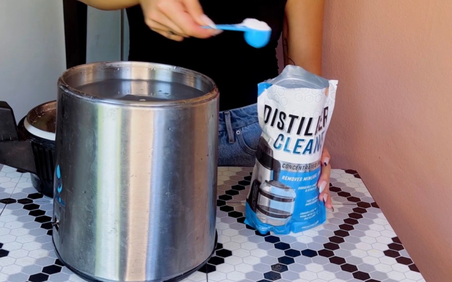 hand scooping distller cleaner