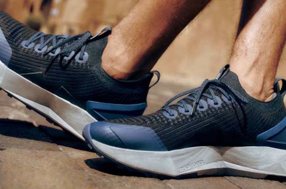 man wearing a pair of blue allbirds running shoes