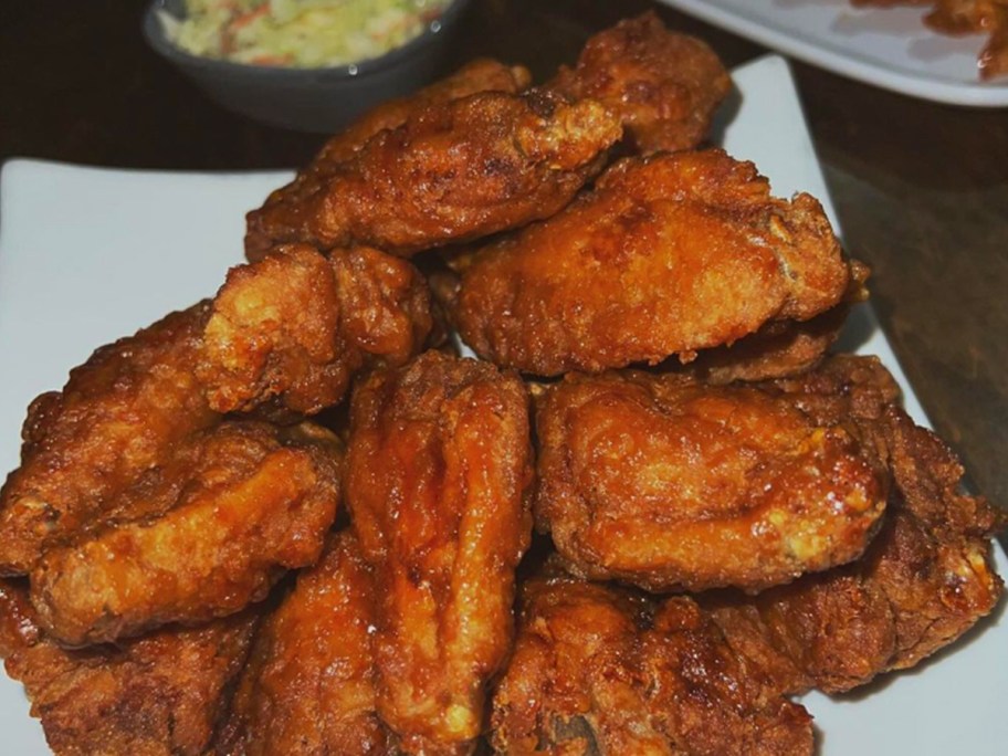 pile of chicken wings on a white plate