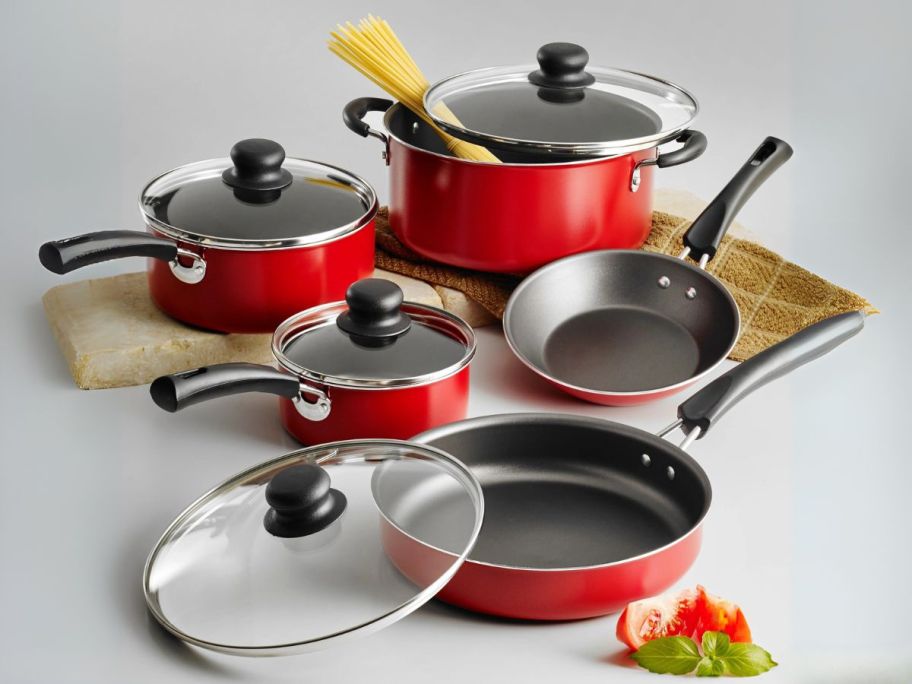 red Tramontina 9-Piece Non-Stick Cookware Set with pasta and tomatoes 