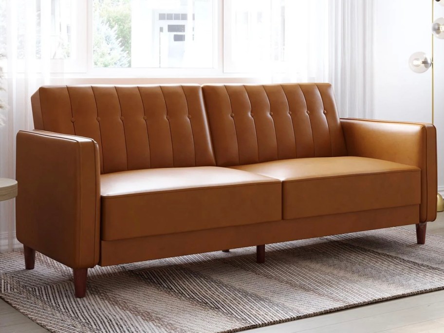 brown leather tufted sofa in living room 