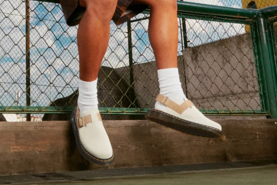 white mules sitting on fence