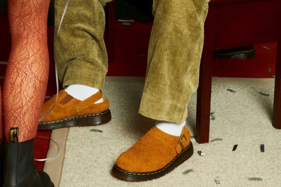 brown sherpa mules on feet