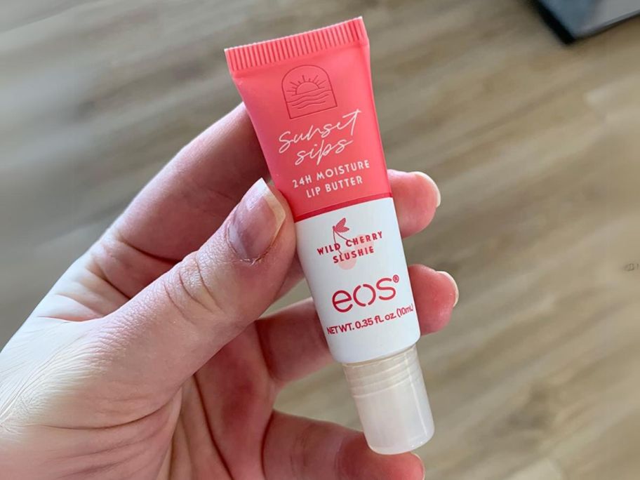 hand holding eos Sunset Sips Lip Butter Tube