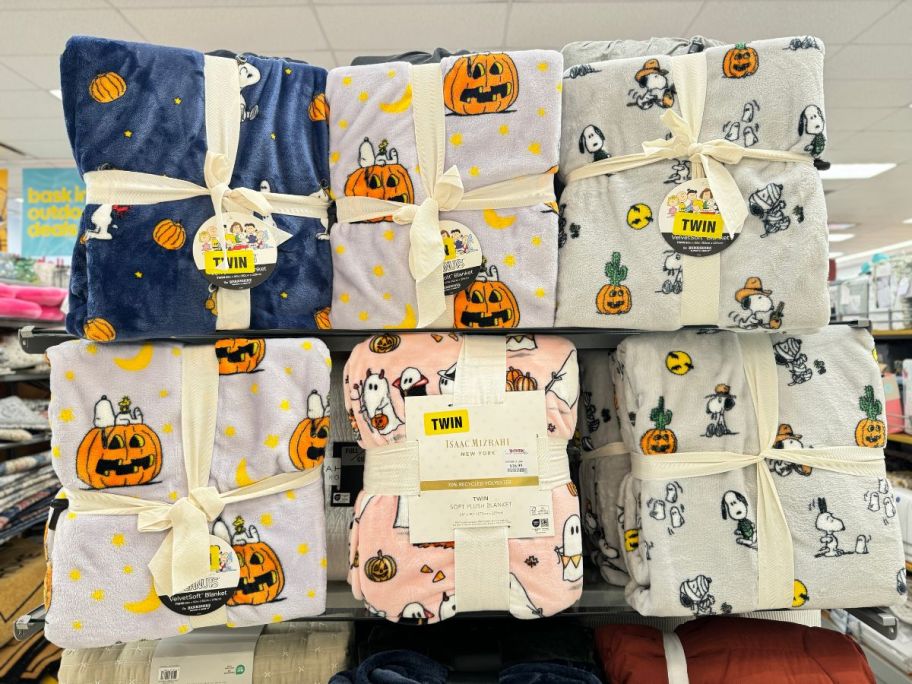 halloween plush blankets on a store shelf