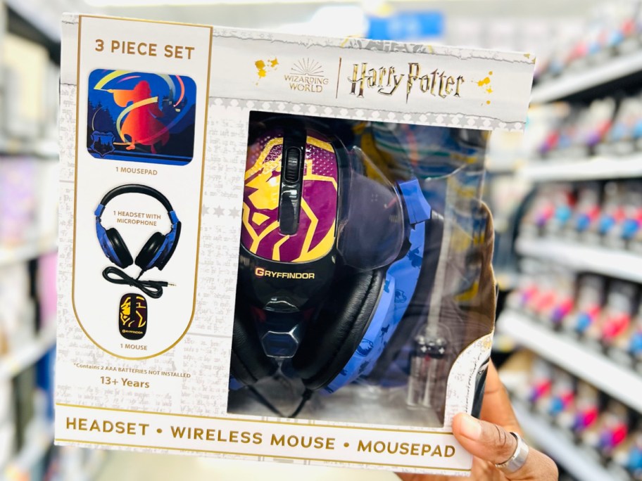 hand holding harry potter stitch headphones