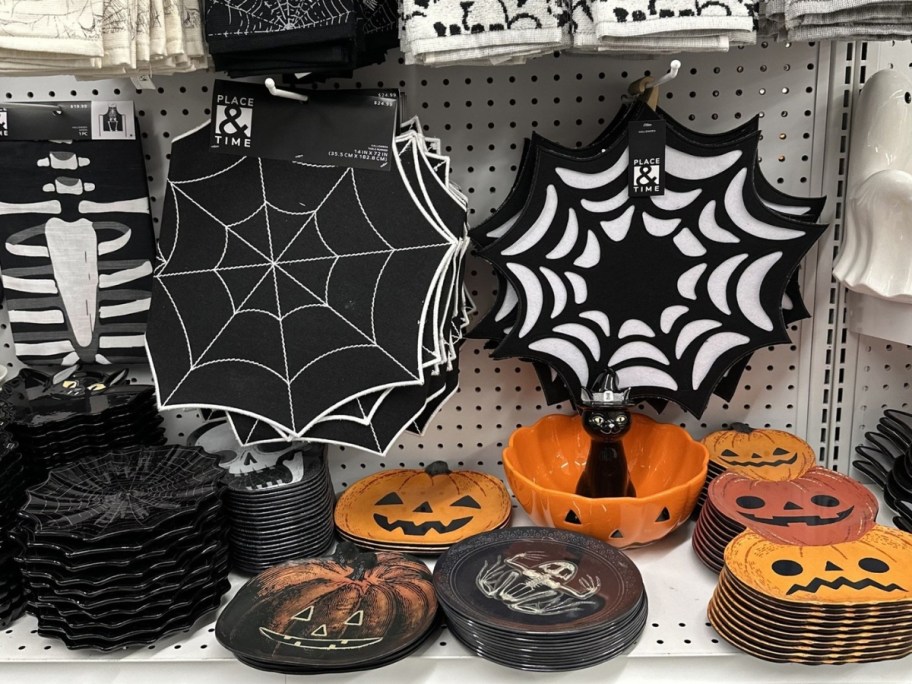 Halloween themed placemats, serving bowls and plates on display in a store