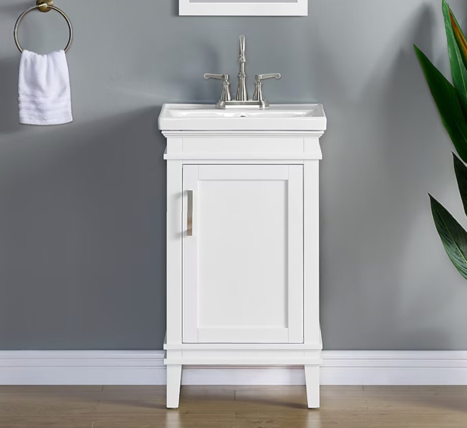 white bathroom vanity with legs