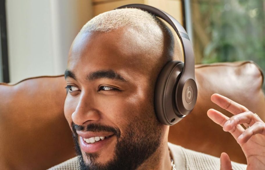 a man wearing a pair of on ear headphones