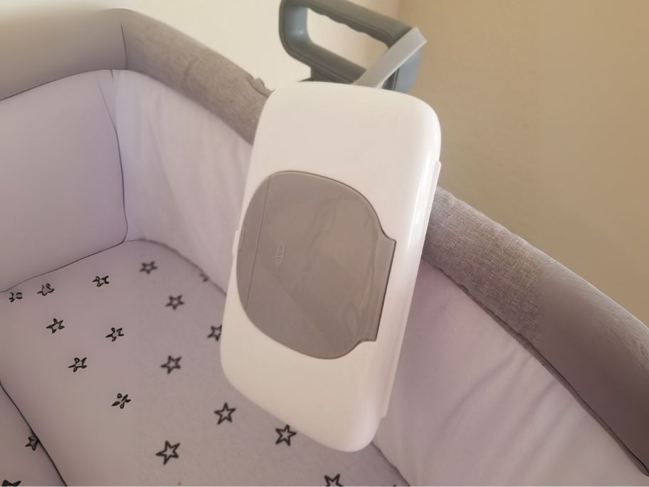 OXO Tot On-The-Go Wipes Dispenser in bassinet