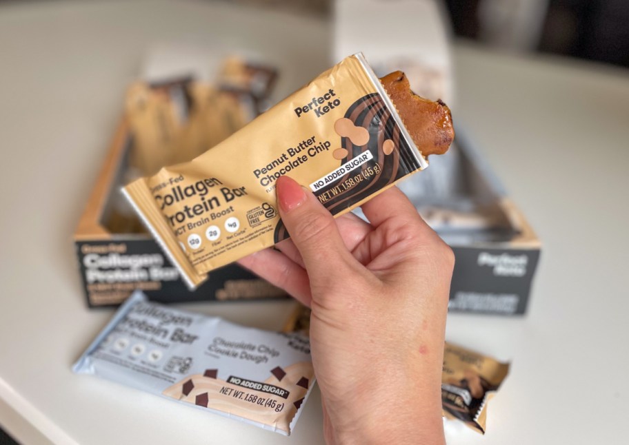 hand holding unwrapped keto bar