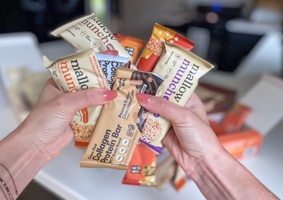 hands holding several perfect keto bars