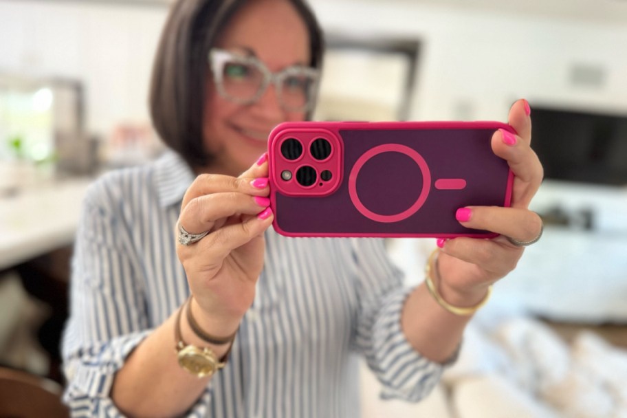 woman holding pink magnetic phone case