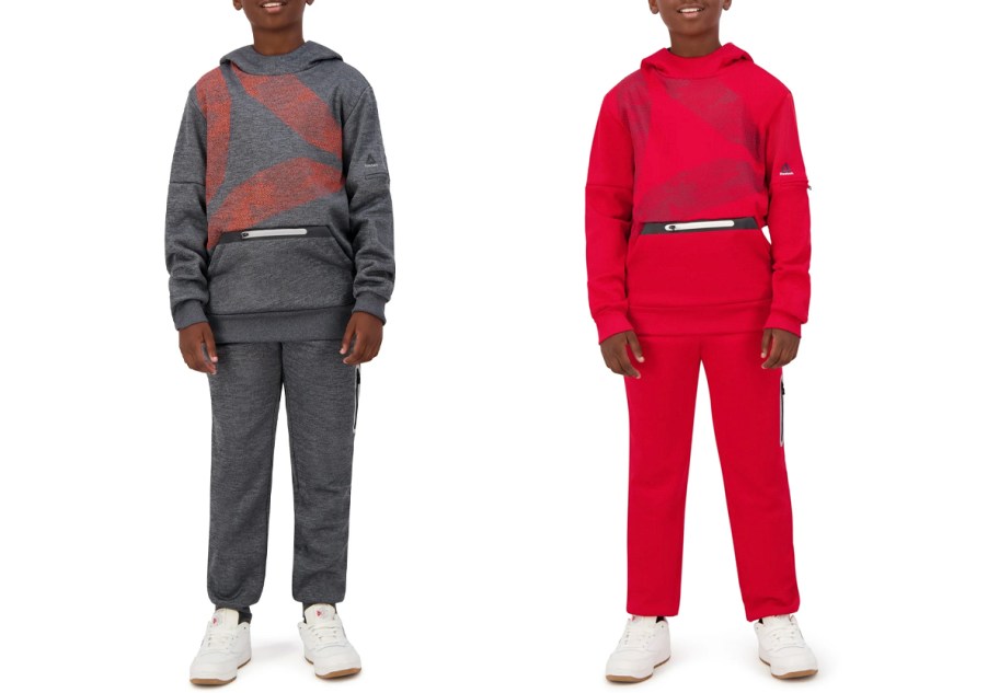 two boys wearing gray and red reebok jogger sets 