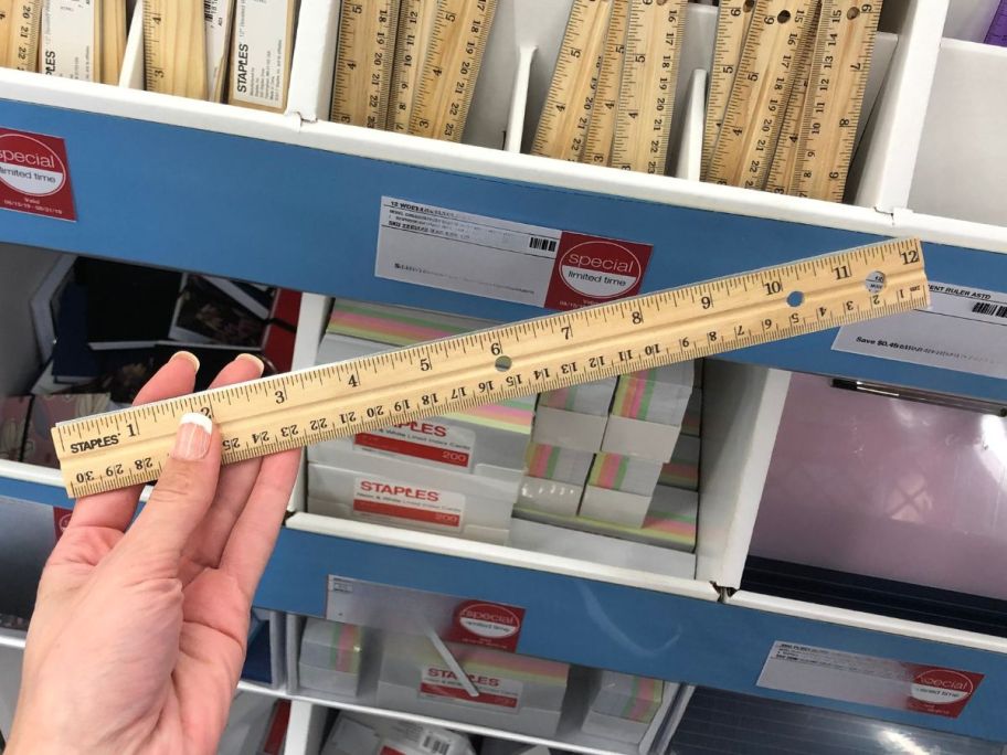 Staples 12" Wooden Imperial/Metric Ruler in hand in store