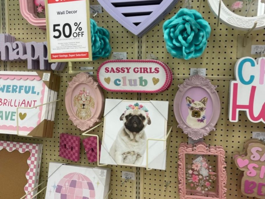 girly wall art and puppy wall art hanging in store