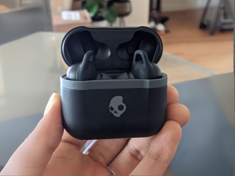 hand holding Skullcandy Indy Evo True Wireless In-Ear Bluetooth Earbuds in black