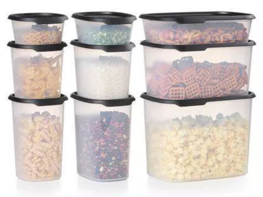 set of 8 clear Tupperware containers with blacks lids and dry foods inside