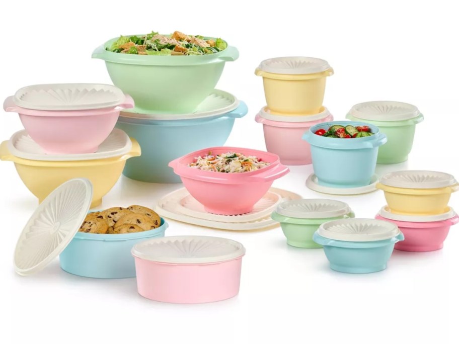 large set of Tupperware bowls and containers in light pastel colors