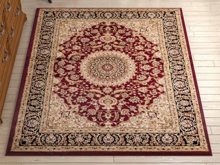 red and beige oriental area rug on floor 