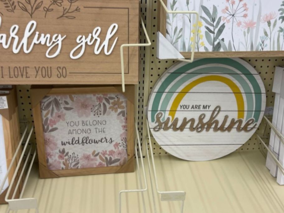 wildflower and sunshine wall art hanging in store