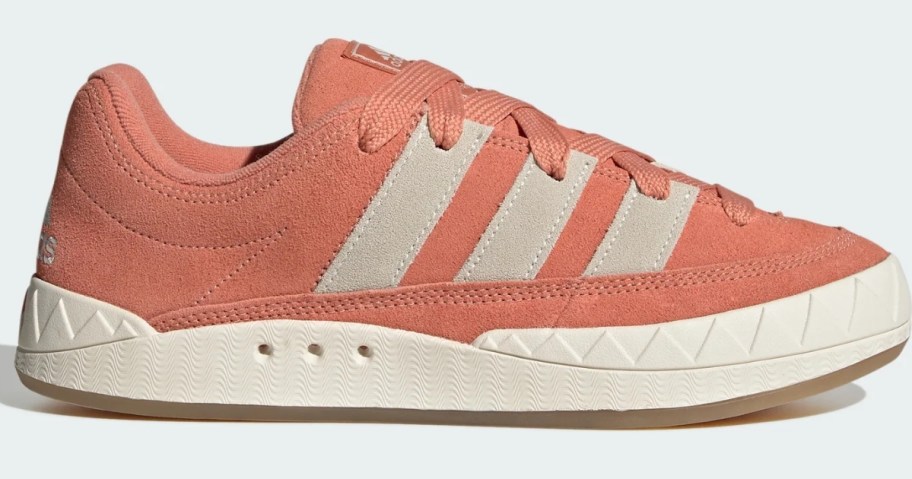 orange and off white men's low top adidas shoes