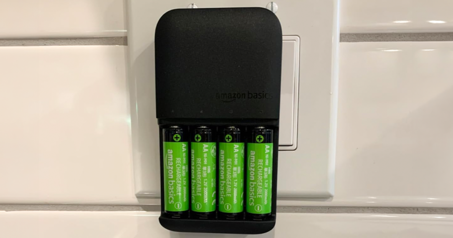 Amazon Battery Charger with 4 AA batteries charging on a wall