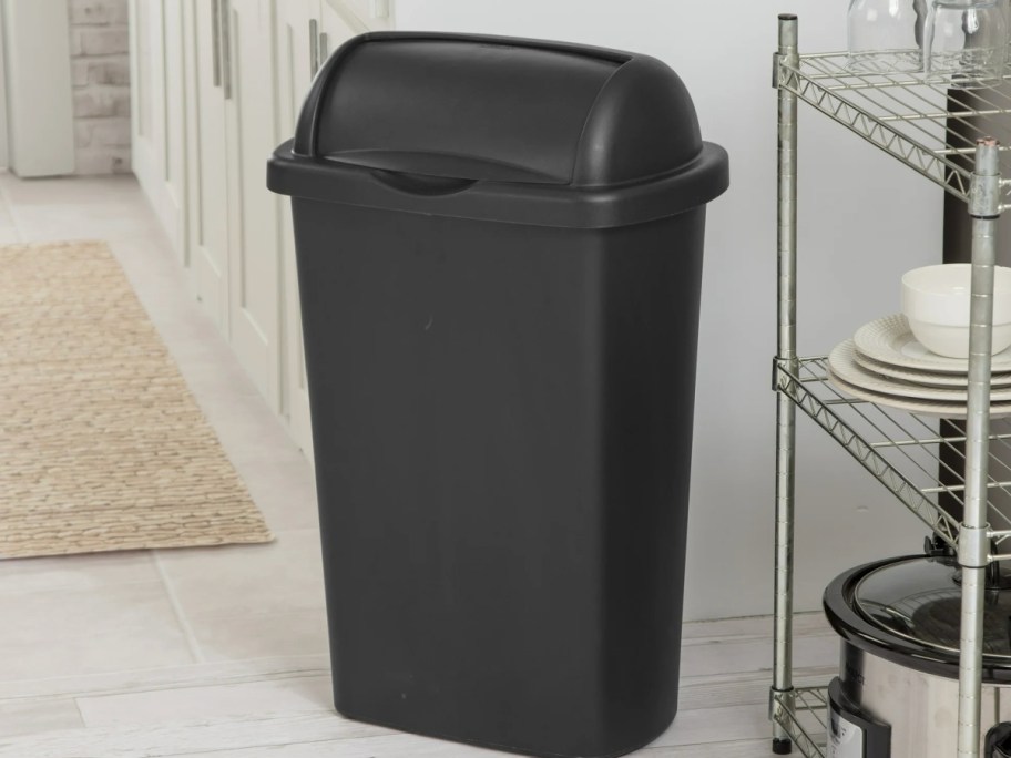 Black roll top trashcan in kitchen