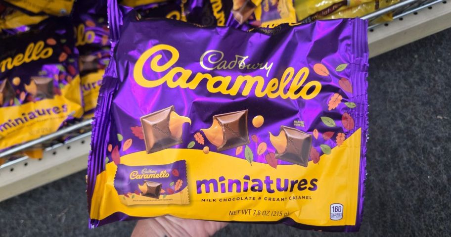 hand holding cadbury caramello miniatures bag 