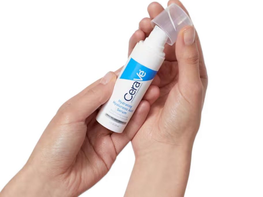 hand holding CeraVe serum