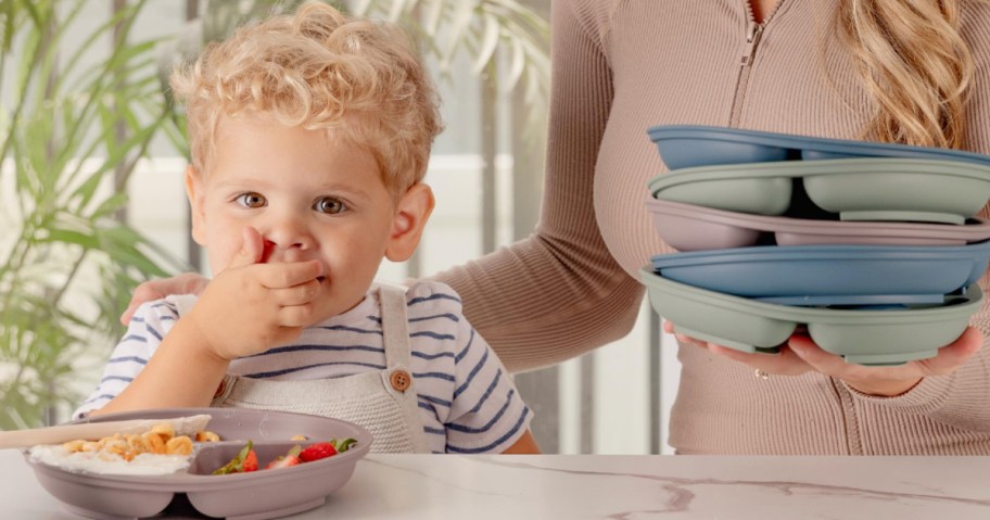 Kid eating from sectioned plate